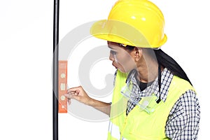 Asian Architect Engineer woman in yellow hard hat, safety vast