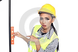 Asian Architect Engineer woman in yellow hard hat, safety vast