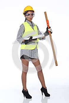 Asian Architect Engineer woman in yellow hard hat, safety vast