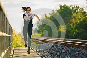 Asian athletics woman in sportswear having sprinter running practice