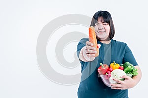 Asian attractive fat woman showing and holding glass bowl  contains fruit and fresh vegetables