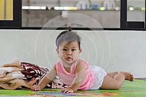 Asian babies crawling on the house floor