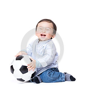 Asian baby boy feel excited playing soccer ball