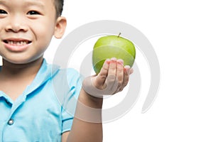 Asian baby boy holding and eating red apple, isolated on white