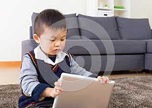 Asian baby boy using digital tablet