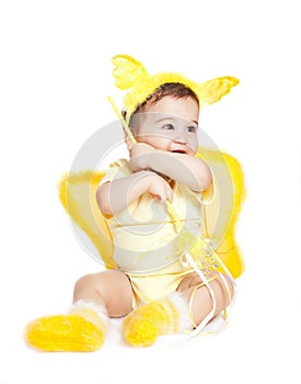 Asian baby boy in a yellow fancy dress