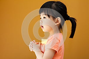 Asian baby child girl is praying photo
