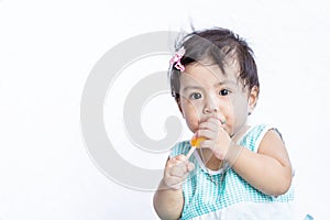 Asian baby eating ice cream after she stop crying