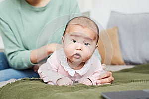 Asian baby girl on the bed