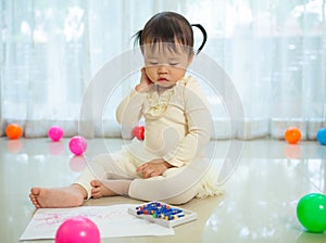 Asian baby girl painting