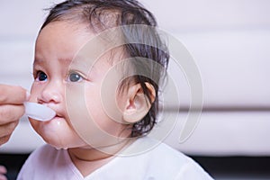 Asian baby girl sick he take medicine by spoon