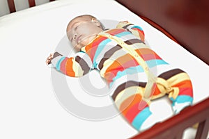 Asian Baby Sleeping on the baby crib