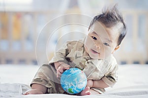 Asian baby in soldier uniform