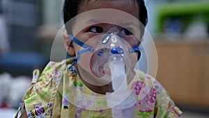 Asian baby was sick as respiratory syncytial virus rsv in kid hospital. Thai little girl having inhaler containing medicine