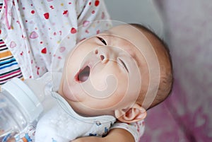 Asian baby yawning