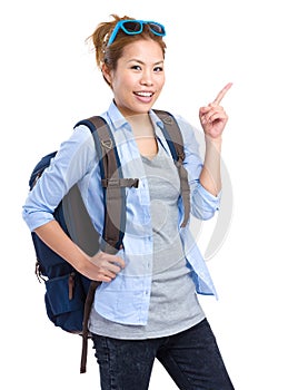 Asian backpacker with finger pointing up