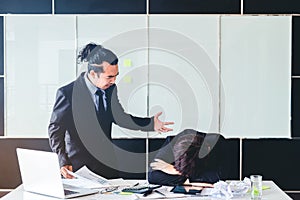 Asian Bad angry boss yelling at business man sad depressed employee reprimand from team leader missed deadline concept photo