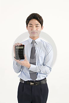 Asian bank teller with a calculator