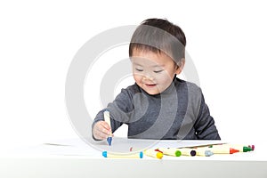 Asian bay boy concentrate on drawing photo