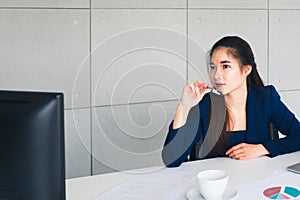 Asian beautiful business woman have worry in her thinking