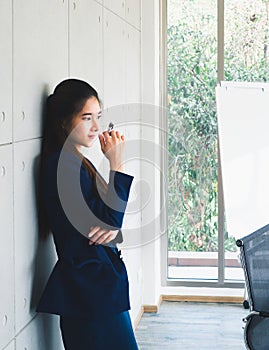 Asian beautiful business woman thinking portrait