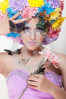 Asian Beautiful Girl With colorful make up with fresh Chrysanthemum Flowers and Butterfly