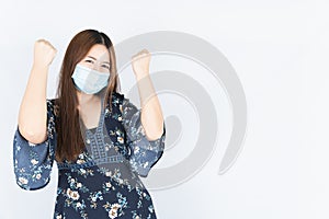 Asian beautiful happy hipster woman wearing a medical protection face mask for protect the coronavirus, filter dust PM 2.5 and