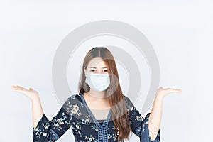 Asian beautiful happy hipster woman wearing a medical protection face mask for protect the coronavirus, filter dust PM 2.5 and