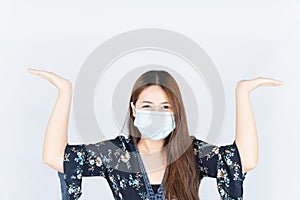 Asian beautiful happy hipster woman wearing a medical protection face mask for protect the coronavirus, filter dust PM 2.5 and