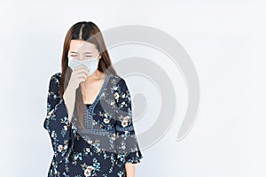 Asian beautiful happy hipster woman wearing a medical protection face mask for protect the coronavirus, filter dust PM 2.5 and
