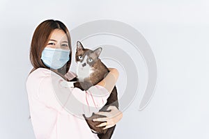 Asian beautiful happy woman wearing a medical protection face mask for protect the coronavirus, filter dust PM 2.5, cold and