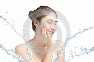 Asian Beautiful model. Beautiful Smiling girl under splash of water with fresh skin on white background