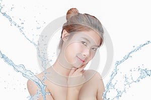 Asian Beautiful model. Beautiful Smiling girl under splash of water with fresh skin on white background