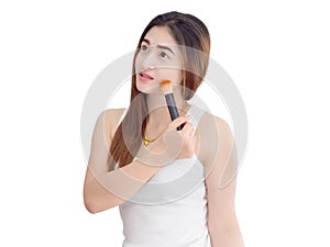 Asian beautiful woman applying cosmetic powder brush on smooth face isolated on white background. skincare.