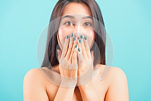 Asian beautiful woman her shocked or surprised her use hands close mouth staring eyes look camera