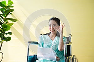 Asian beautiful woman patients raise up her hands ok sign symbol,Happy and smiling