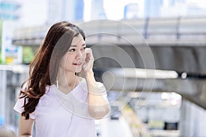 Asian beautiful woman tourist has music listening with headphone