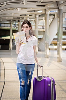 Asian beautiful woman tourist walking and travel with big purple