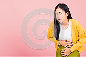 Asian beautiful young woman has stomachache