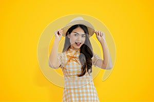 Asian Beauty girl happy joy posing model on yellow studio background