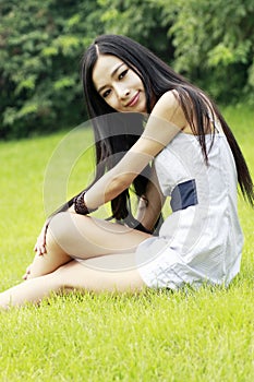 Asian beauty relaxing outdoors