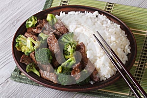 Asian beef with broccoli and rice close-up. Horizontal