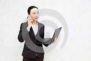 Asian black Business Woman on Cell Phone