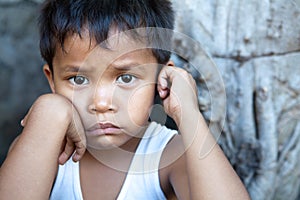 Asian boy against wall portrait