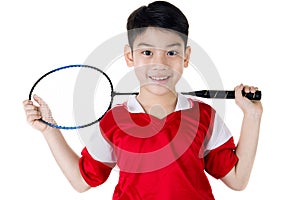 Asian boy in badminton action