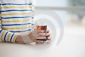 asian boy drinking soft drink cola soda