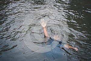 Asian boy drowning in the pool dangerous and need to help