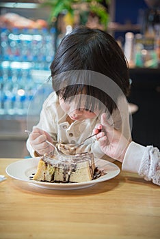 Asian boy eating honey toast