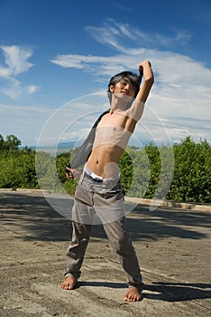Asian boy fashion pose outdoors