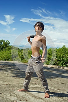 Asian boy fashion pose outdoors